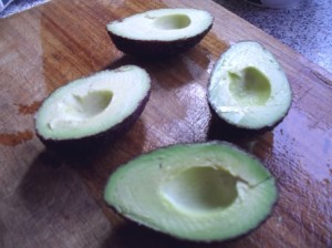 Cut the avocados in half