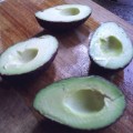 Cut the avocados in half